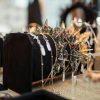 Crown and jewelry display showcasing elegant gemstones and intricate designs on a velvet stand.